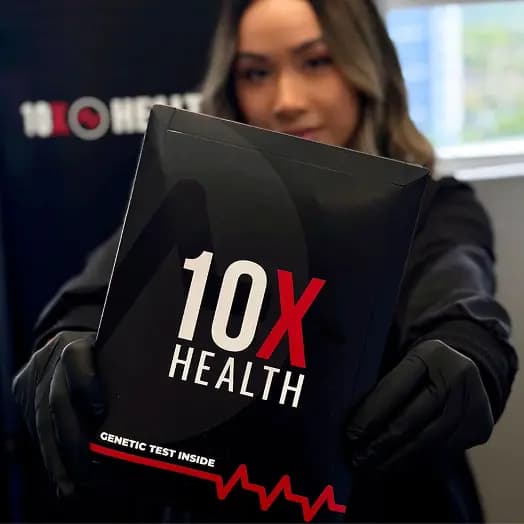 Person holding up a 10X Health genetic test